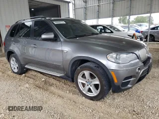 2012 BMW X5 35d with VIN 5UXZW0C53CL671564, listed as a Copart auction lot 60880715 with 154,401 mi miles and Clean title. Bid and sale history available at DreamBid. Image 4.