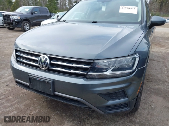 2021 Volkswagen Tiguan SE with VIN 3VV2B7AX6MM054611, listed as a IAAI auction lot 41978323 with 23,029 mi miles and . Bid and sale history available at DreamBid. Image 6.