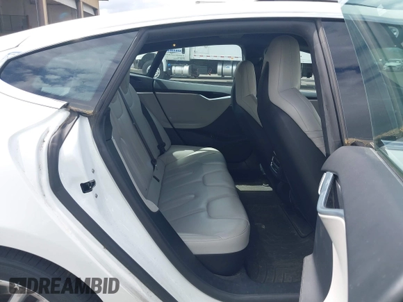 2016 Tesla Model S 90D with VIN 5YJSA1E21GF121962, listed as a IAAI auction lot 42130291 with 114,670 mi miles and . Bid and sale history available at DreamBid. Image 8.