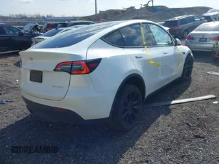 2023 Tesla Model Y Long Range with VIN 7SAYGDEE4PF780951, listed as a IAAI auction lot 41856461 with 63,317 mi miles. Bid and sale history available at carsss.com. Image 4.
