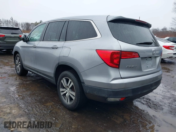 2017 Honda Pilot EX-L with VIN 5FNYF6H51HB069068, listed as a IAAI auction lot 41567728 with 100,618 mi miles and . Bid and sale history available at DreamBid. Image 3.