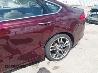 2017 Ford Fusion Titanium with VIN 3FA6P0K97HR214485, listed as a IAAI auction lot 40208619 with 39,265 mi miles and . Bid and sale history available at DreamBid. Image 6.