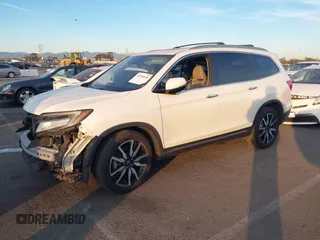 2019 Honda Pilot Touring 8-Passenger with VIN 5FNYF5H97KB005203, listed as a IAAI auction lot 41399930 with 47,267 mi miles and . Bid and sale history available at DreamBid. Image 2.