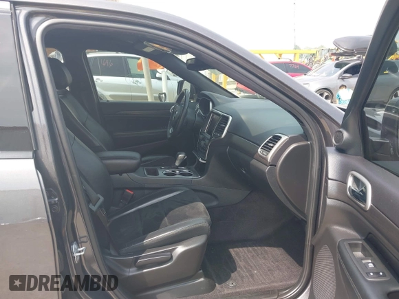 2018 Jeep Grand Cherokee Laredo E with VIN 1C4RJFAG7JC294905, listed as a IAAI auction lot 42452977 with 75,916 mi miles and . Bid and sale history available at DreamBid. Image 5.