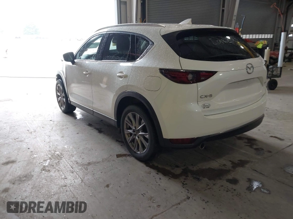 2020 Mazda CX-5 Grand Touring with VIN JM3KFADMXL0742038, listed as a IAAI auction lot 42292400 with 68,339 mi miles and . Bid and sale history available at DreamBid. Image 3.