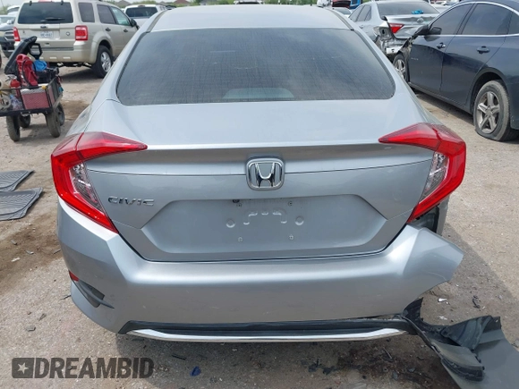2019 Honda Civic LX with VIN 19XFC2F66KE026931, listed as a IAAI auction lot 41885137 with 55,057 mi miles and . Bid and sale history available at DreamBid. Image 16.