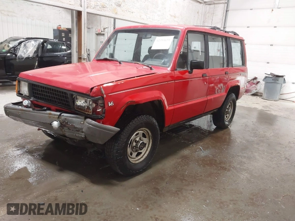 1991 Isuzu Trooper z VIN JACCH58R6M8905869, wystawiony jako IAAI lot #42394651 z przebiegiem 117 130 mil mil oraz . Historia ofert i sprzedaży dostępna na DreamBid. Obrazek 17.