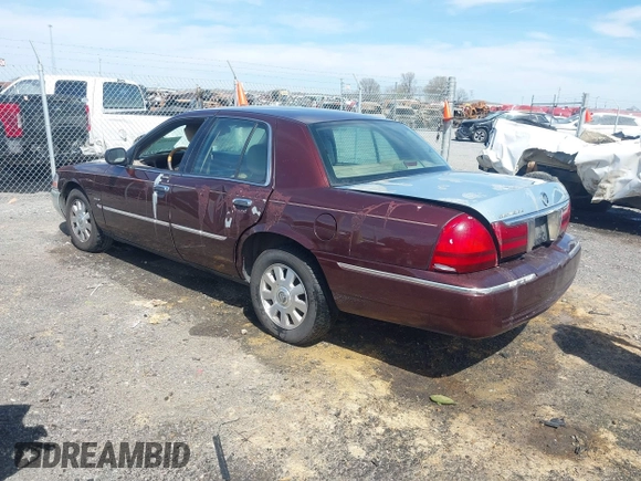 2003 Mercury Grand Marquis LS Premium z VIN 2MEFM75W73X650193, wystawiony jako IAAI lot #41803310 z przebiegiem 151 719 mil mil oraz . Historia ofert i sprzedaży dostępna na DreamBid. Obrazek 3.