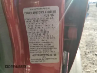 1997 Isuzu Rodeo z VIN 4S2CK58VXV4315798, wystawiony jako Copart lot #68860764 z przebiegiem 241 215 mil mil oraz Szkoda całkowita • Salvage title. Historia ofert i sprzedaży dostępna na DreamBid. Obrazek 13.