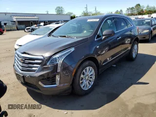 2018 Cadillac XT5 AWD with VIN 1GYKNBRS8JZ203963, listed as a Copart auction lot 57243165 with 18,407 mi miles and Salvage title. Bid and sale history available at DreamBid. Image 1.