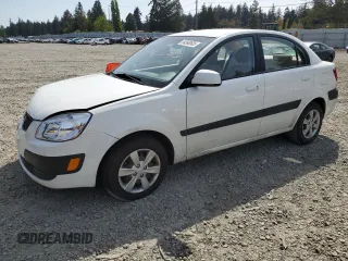 2009 Kia Rio LX with VIN KNADE223896456292, listed as a Copart auction lot 54990605 with 61,220 mi miles and Salvage Title. Bid and sale history available at DreamBid. Image 1.