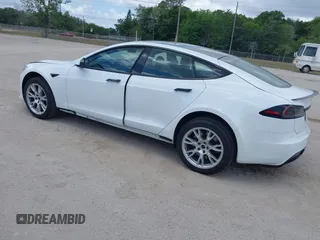 2022 Tesla Model S Plaid with VIN 5YJSA1E6XNF473888, listed as a IAAI auction lot 42141141 with 28,584 mi miles and . Bid and sale history available at carsss.com. Image 3.