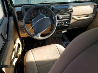 2002 Jeep Wrangler SE z VIN 1J4FA29P72P711802, wystawiony jako Copart lot #52640405 z przebiegiem 107 046 mil mil oraz Czysty tytuł • Clean title. Historia ofert i sprzedaży dostępna na DreamBid. Obrazek 8.