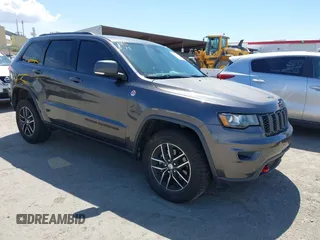 2017 Jeep Grand Cherokee Trailhawk with VIN 1C4RJFLG3HC877110, listed as a IAAI auction lot 42276506 with 144,993 mi miles and . Bid and sale history available at DreamBid. Image 1.