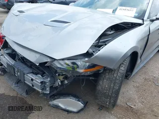 2020 Ford Mustang EcoBoost z VIN 1FA6P8TH2L5186210, wystawiony jako IAAI lot #42103657 z przebiegiem 68 790 mil mil oraz . Historia ofert i sprzedaży dostępna na DreamBid. Obrazek 6.