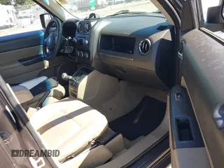 2014 Jeep Patriot Latitude with VIN 1C4NJPFA5ED928074, listed as a IAAI auction lot 42035754 with 155,636 mi miles and . Bid and sale history available at carsss.com. Image 5.