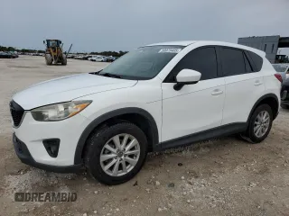 2014 Mazda CX-5 Touring z VIN JM3KE4CY0E0422318, wystawiony jako Copart lot #58973405 z przebiegiem 146 692 mil mil oraz Szkoda całkowita • Salvage title. Historia ofert i sprzedaży dostępna na DreamBid. Obrazek 1.