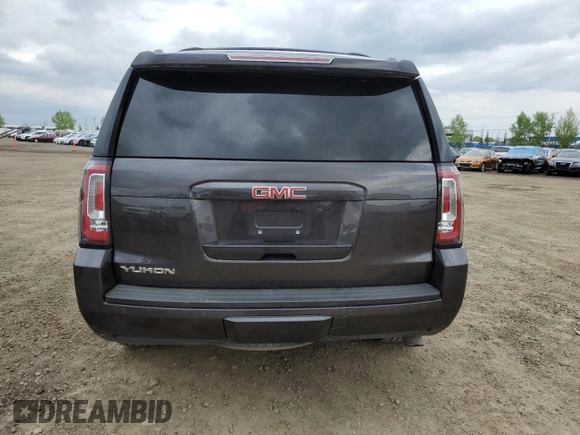 2015 GMC Yukon SLT z VIN 1GKS2BKCXFR269881, wystawiony jako Copart lot #57678175 z przebiegiem 256 703 mil mil oraz Czysty tytuł • Clean title. Historia ofert i sprzedaży dostępna na DreamBid. Obrazek 6.