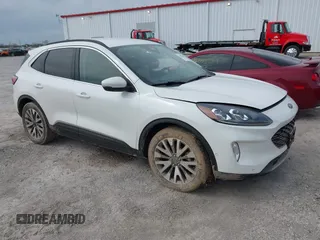 2020 Ford Escape Titanium z VIN 1FMCU9J99LUB45341, wystawiony jako IAAI lot #41992083 z przebiegiem 99 441 mil mil oraz . Historia ofert i sprzedaży dostępna na DreamBid. Obrazek 1.