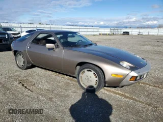 1984 Porsche 928 z VIN WP0JB0920ES860222, wystawiony jako Copart lot #44055645 z przebiegiem 166 689 mil mil oraz Nie do naprawy. Historia ofert i sprzedaży dostępna na DreamBid. Obrazek 4.