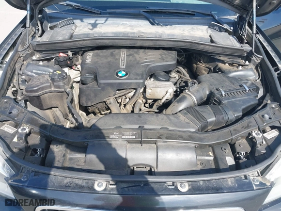 2015 BMW X1 sDrive28i with VIN WBAVM1C59FVW57928, listed as a IAAI auction lot 42056452 with 115,411 mi miles. Bid and sale history available at carsss.com. Image 10.