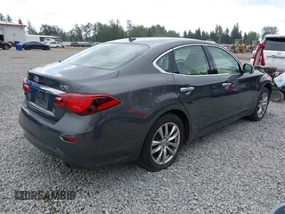 2015 Infiniti Q70 with VIN JN1BY1ARXFM562111, listed as a IAAI auction lot 42473521 with 123,212 mi miles and . Bid and sale history available at DreamBid. Image 4.