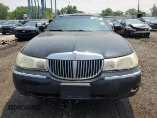 1999 Lincoln Town Car Executive with VIN 1L1FM81W8XY710157, listed as a Copart auction lot 59804965 with Not provided miles and Salvage title. Bid and sale history available at DreamBid. Image 5.