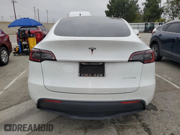 2021 Tesla Model Y Long Range with VIN 5YJYGDEE3MF214823, listed as a Copart auction lot 50738045 with 63,227 mi miles and Salvage Title. Bid and sale history available at DreamBid. Image 6.