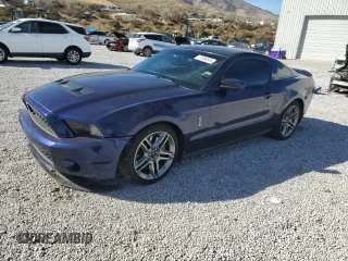 2010 Ford Mustang GT500 with VIN 1ZVBP8JS1A5105926, listed as a Copart auction lot 77398504 with 63,699 mi miles and Salvage title. Bid and sale history available at DreamBid. Image 1.