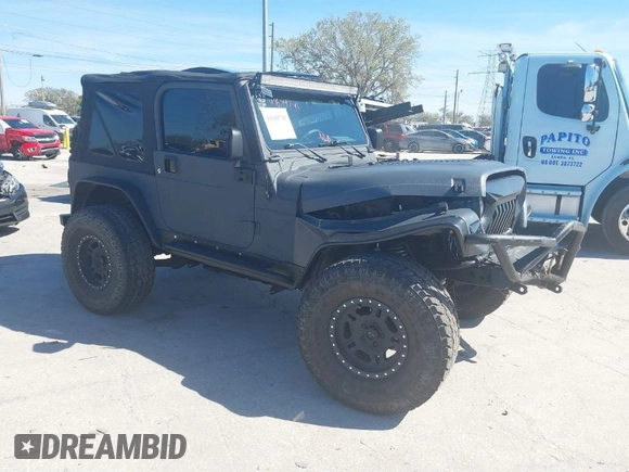 2003 Jeep Wrangler X with VIN 1J4FA39S03P314685, listed as a IAAI auction lot 41649741 with 119,924 mi miles. Bid and sale history available at carsss.com. Image 1.