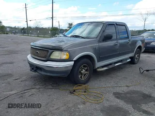 2003 Ford F-150 XLT with VIN 1FTRW07L13KA54535, listed as a IAAI auction lot 41766119 with 236,854 mi miles. Bid and sale history available at carsss.com. Image 2.