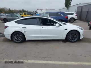 2023 Tesla Model 3 with VIN 5YJ3E1EA5PF505856, listed as a IAAI auction lot 41885837 with 28,206 mi miles and . Bid and sale history available at carsss.com. Image 12.