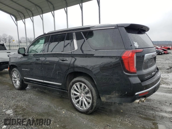 2023 GMC Yukon Denali with VIN 1GKS1DKL8PR402542, listed as a Copart auction lot 42001695 with 23,497 mi miles and Salvage Title. Bid and sale history available at carsss.com. Image 2.