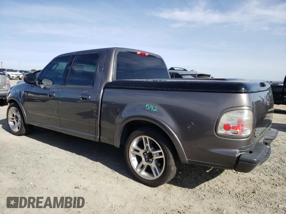 2002 Ford F-150 Harley Davidson with VIN 1FTRW07342KC78218, listed as a Copart auction lot 78273304 with 217,968 mi miles and Salvage Title. Bid and sale history available at carsss.com. Image 2.