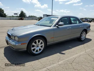 2004 Jaguar XJ 8 with VIN SAJEA71C74SG01277, listed as a Copart auction lot 62124345 with 157,702 mi miles and Salvage title. Bid and sale history available at DreamBid. Image 1.