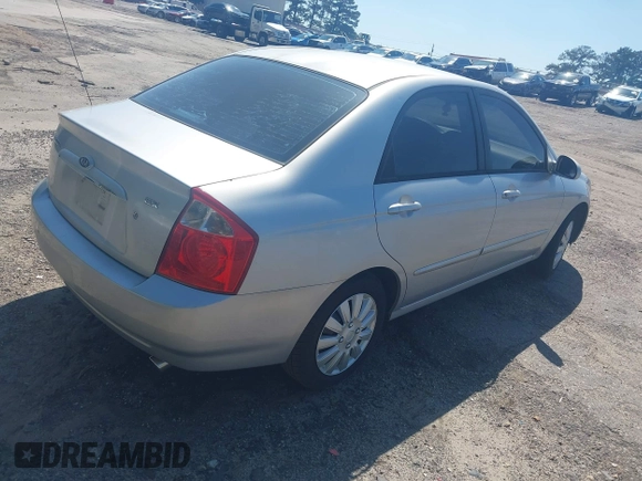 2004 Kia Spectra LX with VIN KNAFE122145037581, listed as a IAAI auction lot 41965681 with 49,817 mi miles. Bid and sale history available at carsss.com. Image 4.