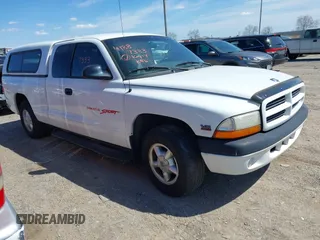 1999 Dodge Dakota SLT z VIN 1B7GL22X6XS220883, wystawiony jako IAAI lot #41887333 z przebiegiem 93 985 mil mil oraz . Historia ofert i sprzedaży dostępna na DreamBid. Obrazek 1.