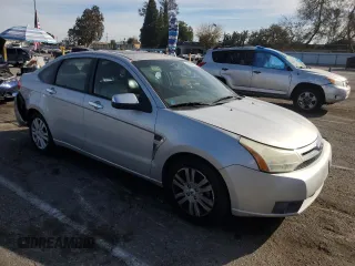 2009 Ford Focus SEL with VIN 1FAHP37N39W232674, listed as a Copart auction lot 42154695 with 127,764 mi miles and Salvage Title. Bid and sale history available at carsss.com. Image 4.