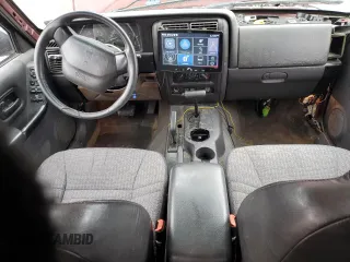 2000 Jeep Cherokee z VIN 1J4FF48S0YL254270, wystawiony jako Copart lot #52589415 z przebiegiem 166 860 mil mil oraz Szkoda całkowita • Salvage title. Historia ofert i sprzedaży dostępna na DreamBid. Obrazek 8.