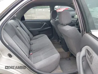 2001 Toyota Camry CE z VIN 4T1BG22K41U847401, wystawiony jako IAAI lot #42275762 z przebiegiem 202 936 mil mil oraz . Historia ofert i sprzedaży dostępna na DreamBid. Obrazek 8.