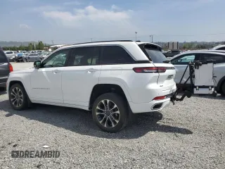 2023 Jeep Grand Cherokee Overland with VIN 1C4RJHDG9PC517056, listed as a Copart auction lot 54929955 with 18,418 mi miles and Salvage title. Bid and sale history available at DreamBid. Image 2.