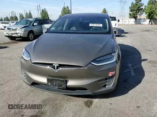 2016 Tesla Model X 70D z VIN 5YJXCBE23GF010836, wystawiony jako Copart lot #57512055 z przebiegiem 115 475 mil mil oraz Szkody całkowita. Historia ofert i sprzedaży dostępna na DreamBid. Obrazek 14.