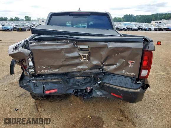 2020 Honda Ridgeline RTL-E with VIN 5FPYK3F79LB001891, listed as a Copart auction lot 58569255 with 34,513 mi miles and Salvage title. Bid and sale history available at DreamBid. Image 6.