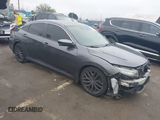 2020 Honda Civic Si z VIN 2HGFC1E52LH700874, wystawiony jako IAAI lot #41882473 z przebiegiem 95 453 mil mil oraz . Historia ofert i sprzedaży dostępna na DreamBid. Obrazek 1.