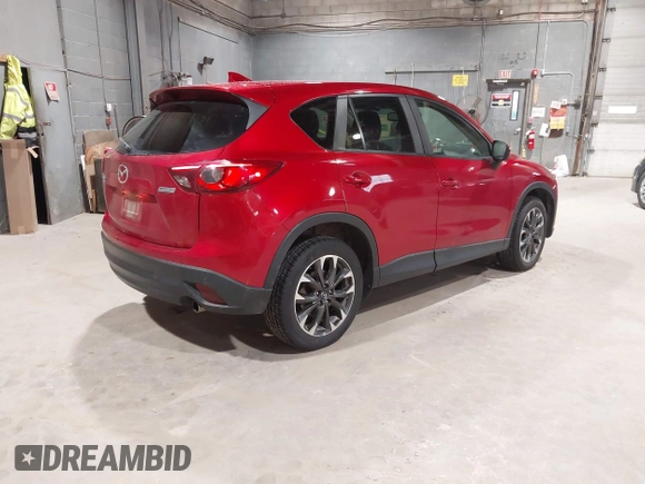 2016 Mazda CX-5 Grand Touring with VIN JM3KE4DY6G0690923, listed as a IAAI auction lot 41875553 with 179,489 mi miles. Bid and sale history available at carsss.com. Image 4.