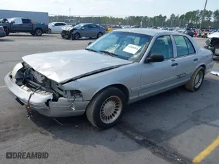 2004 Ford Crown Victoria Standard with VIN 2FAFP73W94X107561, listed as a IAAI auction lot 41804985 with 128,066 mi miles. Bid and sale history available at carsss.com. Image 2.