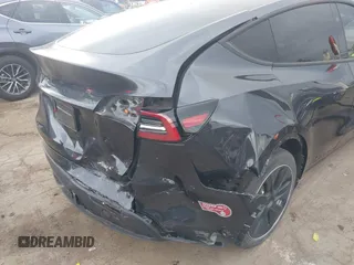 2024 Tesla Model Y with VIN 7SAYGDED8RF116209, listed as a IAAI auction lot 41761804 with 12,048 mi miles and . Bid and sale history available at DreamBid. Image 6.