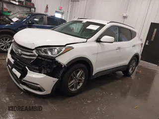 2017 Hyundai Santa Fe 2.4L z VIN 5XYZU3LBXHG444308, wystawiony jako IAAI lot #41685902 z przebiegiem 70 838 mil mil oraz . Historia ofert i sprzedaży dostępna na DreamBid. Obrazek 2.