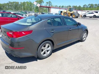 2014 Kia Optima LX with VIN 5XXGM4A71EG335165, listed as a IAAI auction lot 42052378 with 154,574 mi miles. Bid and sale history available at carsss.com. Image 4.
