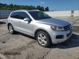 2014 Volkswagen Touareg Lux with VIN WVGEF9BP1ED012267, listed as a Copart auction lot 58924055 with 81,009 mi miles and Salvage title. Bid and sale history available at DreamBid. Image 4.